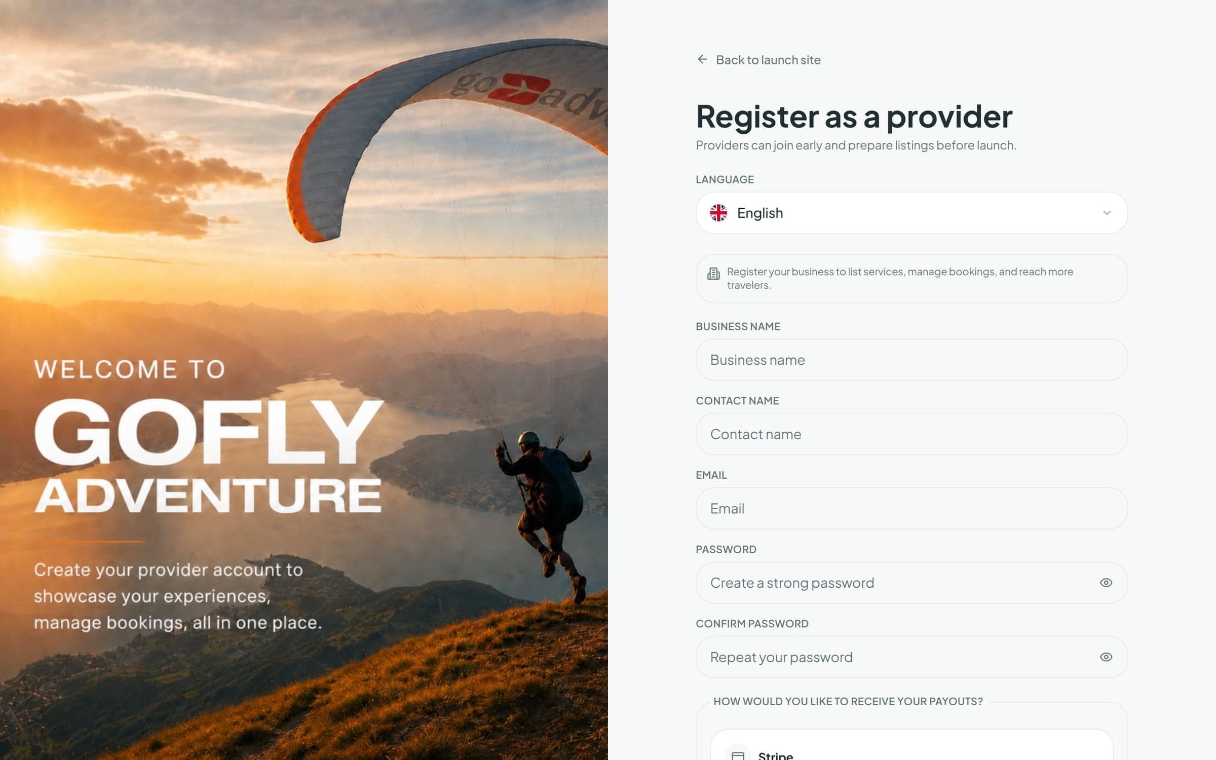 The GoFlyAdventure provider registration page on desktop, with a paraglider photo beside the sign-up form and language selector