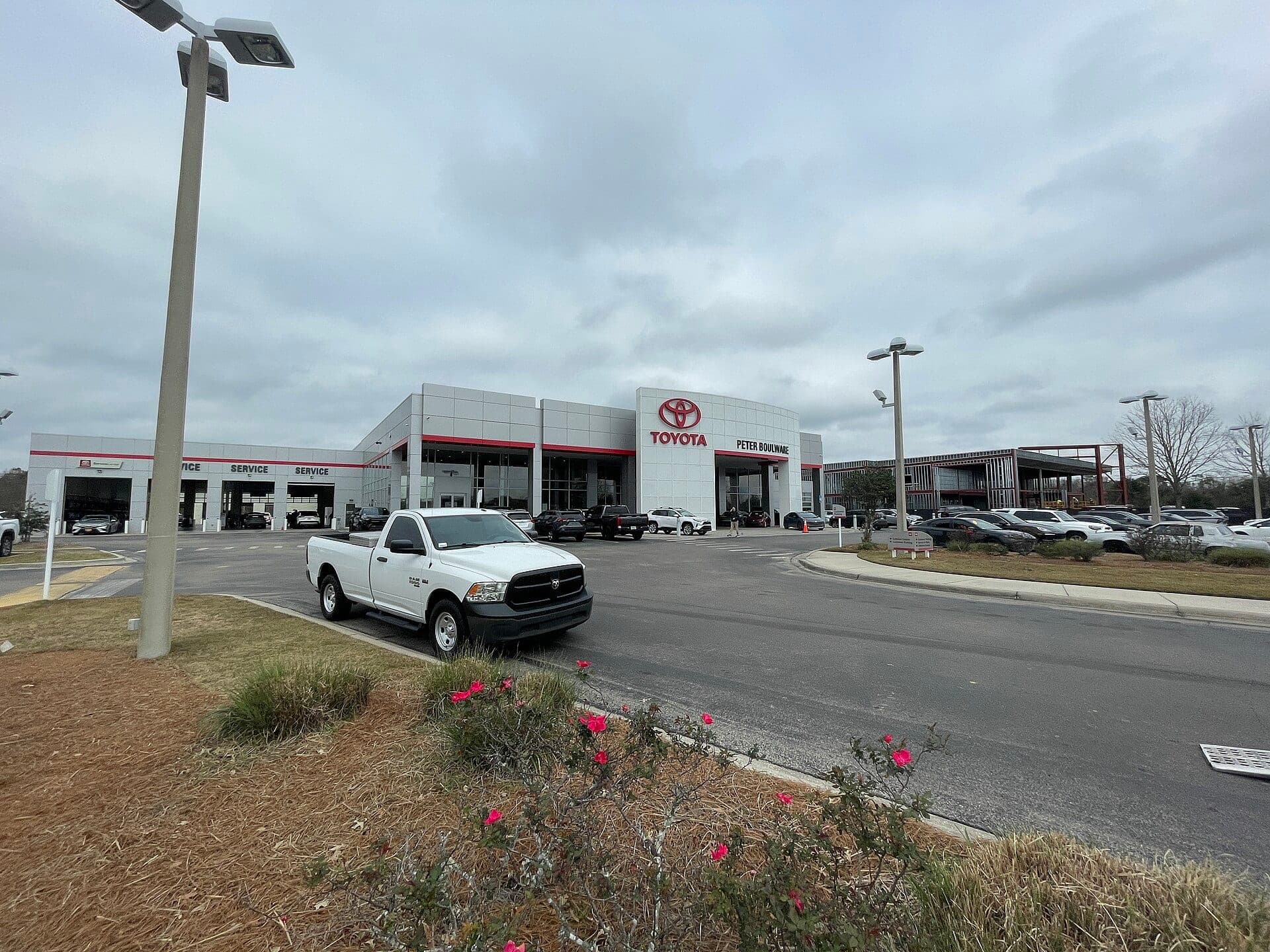 A Toyota dealership showroom and forecourt